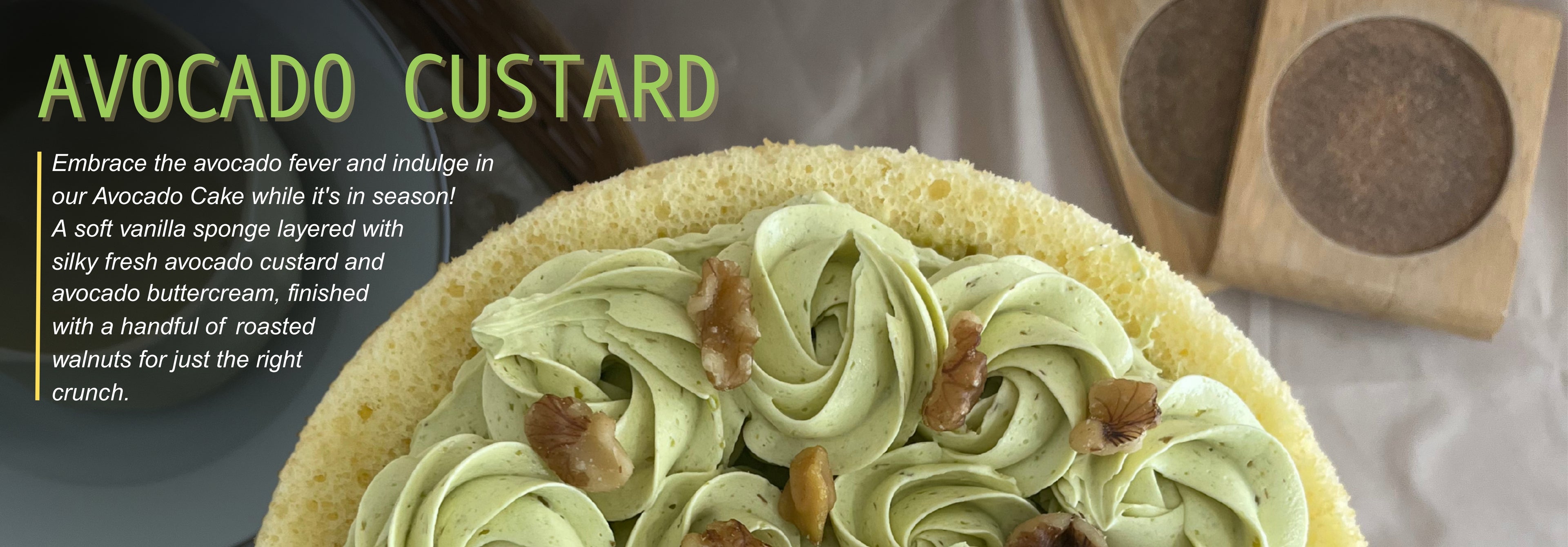 Avocado custard cake with vanilla sponge, avocado buttercream swirls, and roasted walnut topping